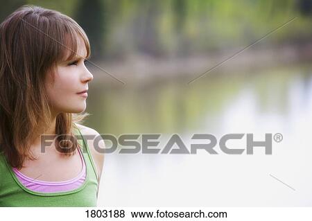 Stock Photo - Girl looking in the distance. Fotosearch
