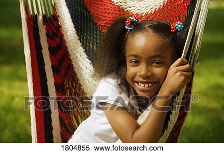 Girl sitting in hammock View Large Photo Image Stock Photography - Girl sitting in hammock. Fotosearch