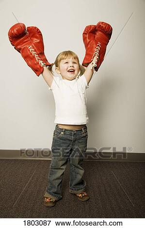 Girl wearing boxing gloves View Large Photo Image Stock Photo - Girl wearing boxing gloves. Fotosearch