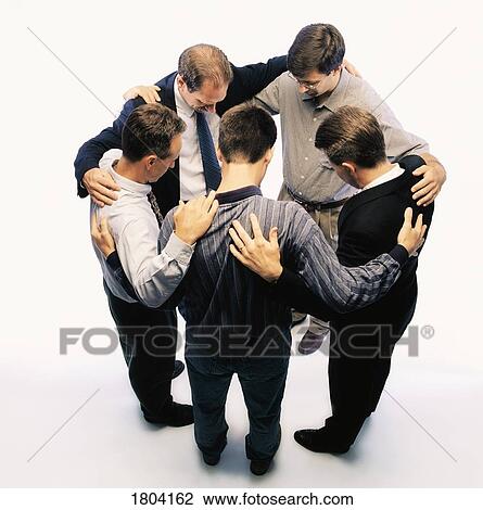 Group of business people praying together View Large Photo Image Stock Image - Group of business people praying together. Fotosearch