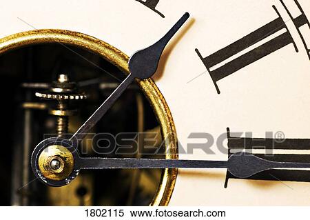 Stock Photography - Hands on a clock. Fotosearch