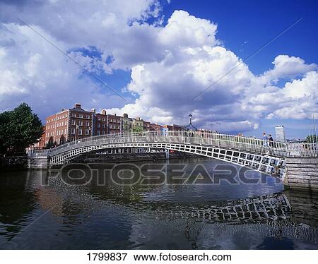 Stock Photo - Ha'penny Bridge over the River Liffey in Dublin, Ireland. Fotosearch
