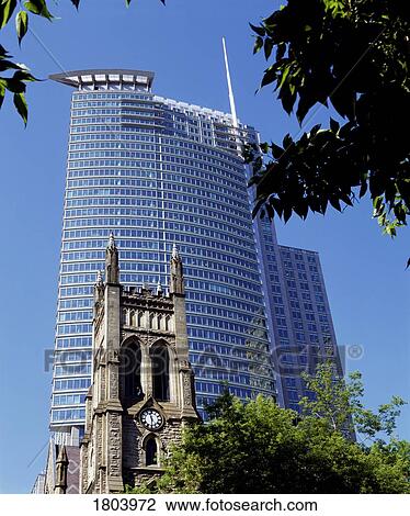 Historic church juxtaposed against modern skyscraper View Large Photo Image Stock Image - Historic church juxtaposed against modern skyscraper. Fotosearch
