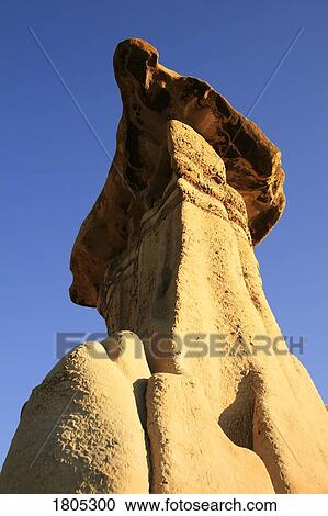 Hoodoos with blue sky in Drumheller, Alberta View Large Photo Image Stock Image - Hoodoos with blue sky in Drumheller, Alberta. Fotosearch
