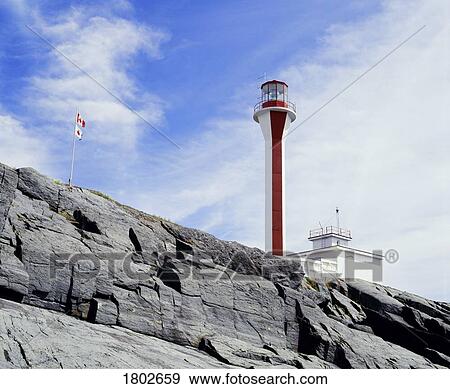 Lighthouse on a cliff View Large Photo Image Stock Photo - Lighthouse on a cliff. Fotosearch