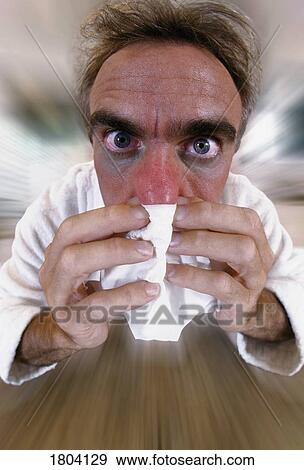 Man blowing nose View Large Photo Image Stock Photo - Man blowing nose . Fotosearch