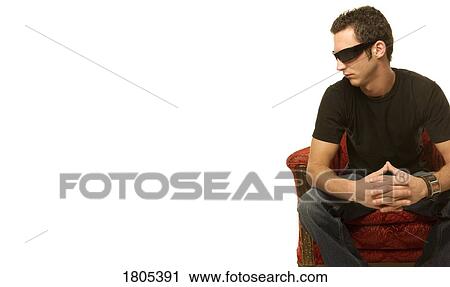 Stock Image - Man sitting on a chair. Fotosearch