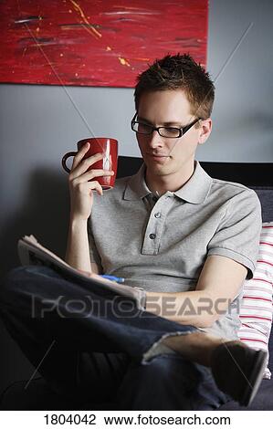 Man writing while sitting with hot drink View Large Photo Image Stock Image - Man writing while sitting with hot drink. Fotosearch
