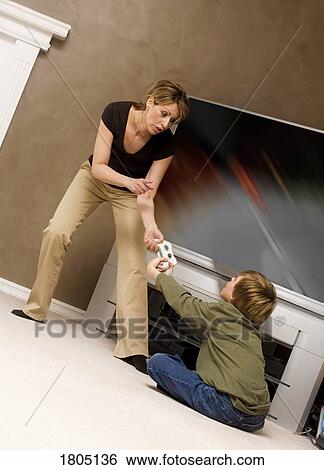 Stock Photograph - Mother putting restrictions on her son. Fotosearch
