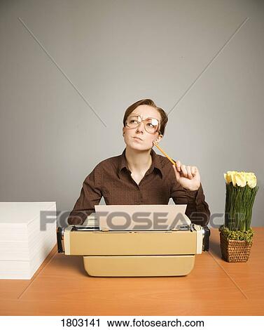 Office worker sitting at desk, thinking View Large Photo Image Stock Image - Office worker sitting at desk, thinking. Fotosearch