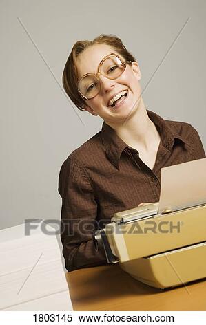 Office worker using typewriter at desk View Large Photo Image Stock Photography - Office worker using typewriter at desk. Fotosearch