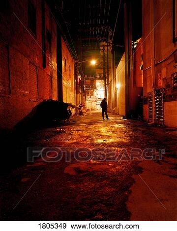 Person standing in the street View Large Photo Image Stock Photo - Person standing in the street. Fotosearch