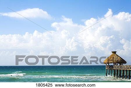 Pier overlooking sea with white clouds View Large Photo Image Stock Photography - Pier overlooking sea with white clouds. Fotosearch