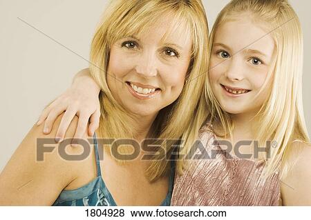 Portrait of a mother and young daughter View Large Photo Image Stock Photo - Portrait of a mother and young daughter. Fotosearch