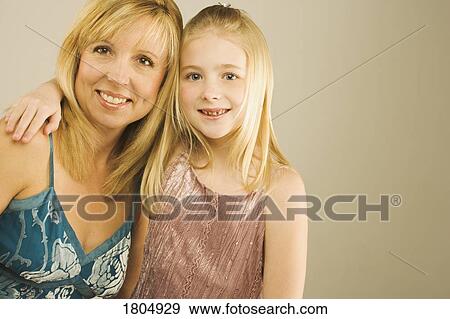 Stock Photo - Portrait of a mother and young daughter. Fotosearch