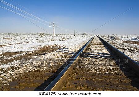 Railroad tracks covered with snow View Large Photo Image Stock Photography - Railroad tracks covered with snow. Fotosearch
