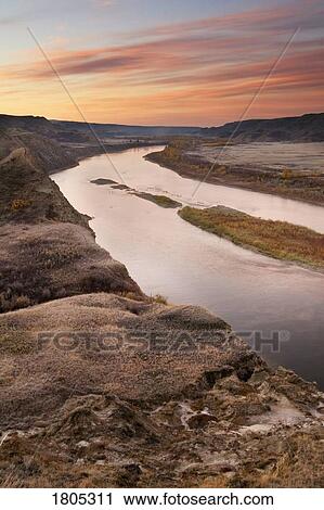 Stock Image - Red Deer River before sunrise in Alberta, Canada. Fotosearch