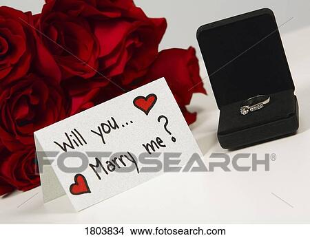 Red roses with engagement ring View Large Photo Image Picture - Red roses with engagement ring. Fotosearch