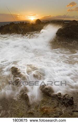 Sea waves breaking over rocks View Large Photo Image Stock Photography - Sea waves breaking over rocks. Fotosearch