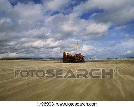 Stock Image - Shipwreck at Baltray Beach in County Louth, Ireland. Fotosearch