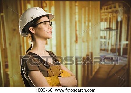 Side view of a woman wearing helmet and smiling View Large Photo Image Stock Photo - Side view of a woman wearing helmet and smiling. Fotosearch