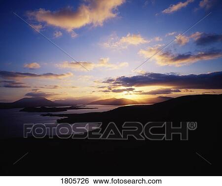 Sunbursts from Valentia Island, Douglas Head to Cahirciveen, Co Kerry, Ireland View Large Photo Image Stock Photograph - Sunbursts from Valentia Island, Douglas Head to Cahirciveen, Co Kerry, Ireland. Fotosearch