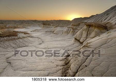 Stock Photo - Sunrise in the badlands, Alberta, Canada . Fotosearch
