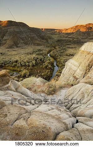 Sunrise in the badlands with valley, Alberta, Canada View Large Photo Image Stock Image - Sunrise in the badlands with valley, Alberta, Canada. Fotosearch