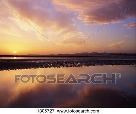 Stock Photo - Sunrise, Sandymount Strand, Dun Laoghaire, Co Dublin, Ireland. Fotosearch