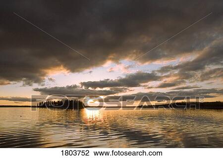 Sunset over Astotin Lake at Elk Island National Park in Alberta, Canada View Large Photo Image Stock Image - Sunset over Astotin Lake at Elk Island National Park in Alberta, Canada . Fotosearch