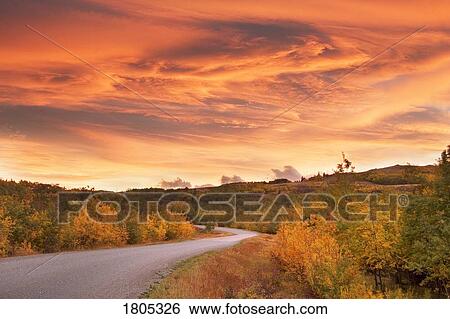 Sunset over road in autumn View Large Photo Image Stock Photograph - Sunset over road in autumn. Fotosearch