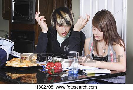 Stock Photo - Teenage couple studying. Fotosearch