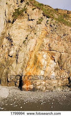 Trace of Iron in Rocks, Lady's Cove, Copper Coast, Co Waterford, Ireland View Large Photo Image Picture - Trace of Iron in Rocks, Lady's Cove, Copper Coast, Co Waterford, Ireland. Fotosearch