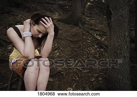 Troubled woman holding head in hands View Large Photo Image Stock Photo - Troubled woman holding head in hands. Fotosearch
