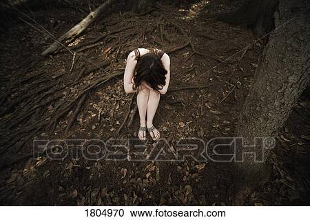 Stock Image - Troubled young woman. Fotosearch
