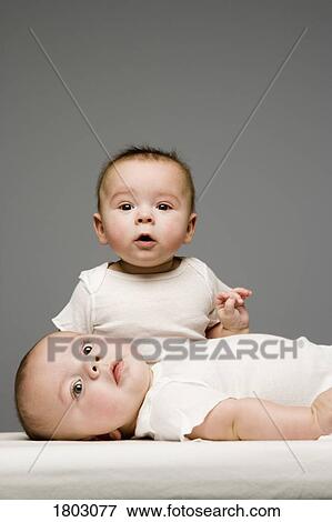 Stock Photo - Two adorable babies. Fotosearch