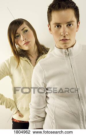 Two young adults modelling View Large Photo Image Stock Image - Two young adults modelling. Fotosearch
