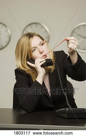 Stock Photo - Woman disinterested in work. Fotosearch