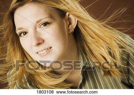 Stock Photo - Woman in the wind. Fotosearch