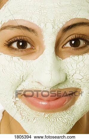 Woman wearing a facial mask View Large Photo Image Picture - Woman wearing a facial mask. Fotosearch
