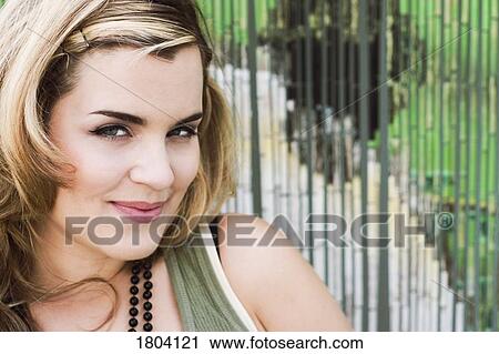 Woman with a coy expression View Large Photo Image Stock Image - Woman with a coy expression. Fotosearch