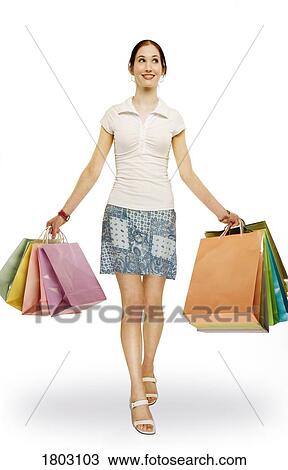 Stock Image - Woman with shopping bags. Fotosearch
