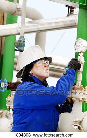 Woman working in a boiler room View Large Photo Image Stock Image - Woman working in a boiler room. Fotosearch