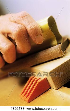 Woodworking with hand sander View Large Photo Image Stock Image - Woodworking with hand sander. Fotosearch