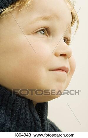Stock Image - Young boy gazing. Fotosearch