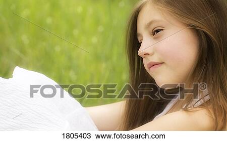 Stock Image - Young girl looking relaxed. Fotosearch