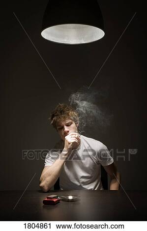 Young man smoking View Large Photo Image Stock Image - Young man smoking. Fotosearch