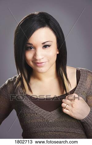 Young woman smiling View Large Photo Image Stock Image - Young woman smiling. Fotosearch