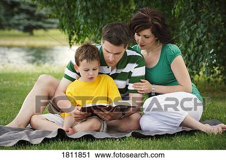 A family reading together View Large Photo Image Stock Image - A family reading together. Fotosearch