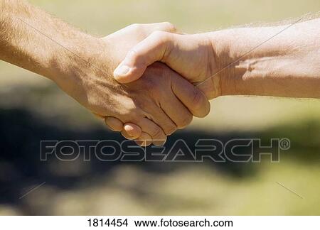 Picture - A firm handshake. Fotosearch